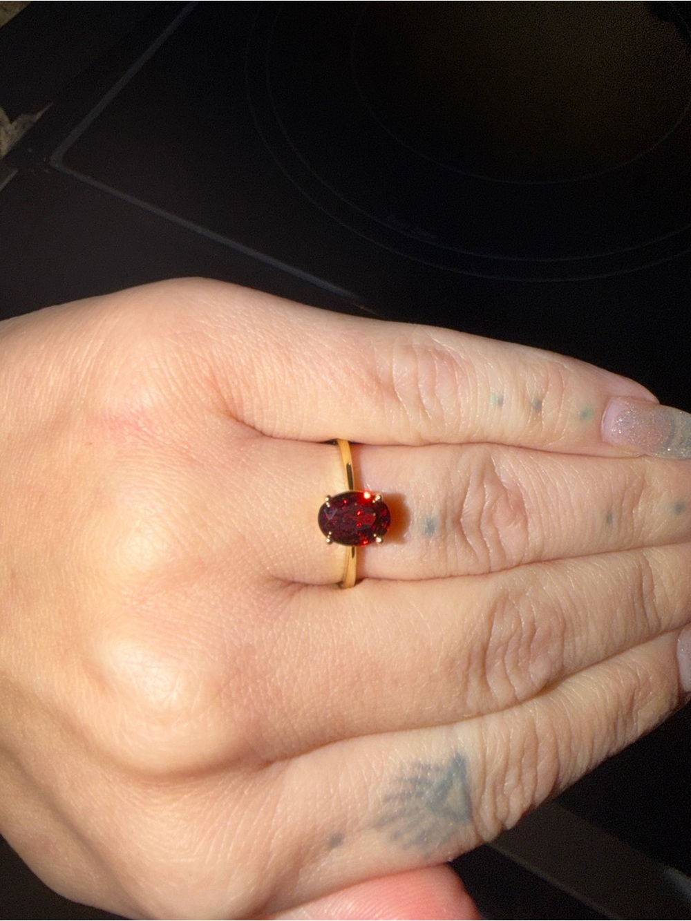Dainty ring. Yellow Gold Band. 0.57 Ct. Oval Red Garnet